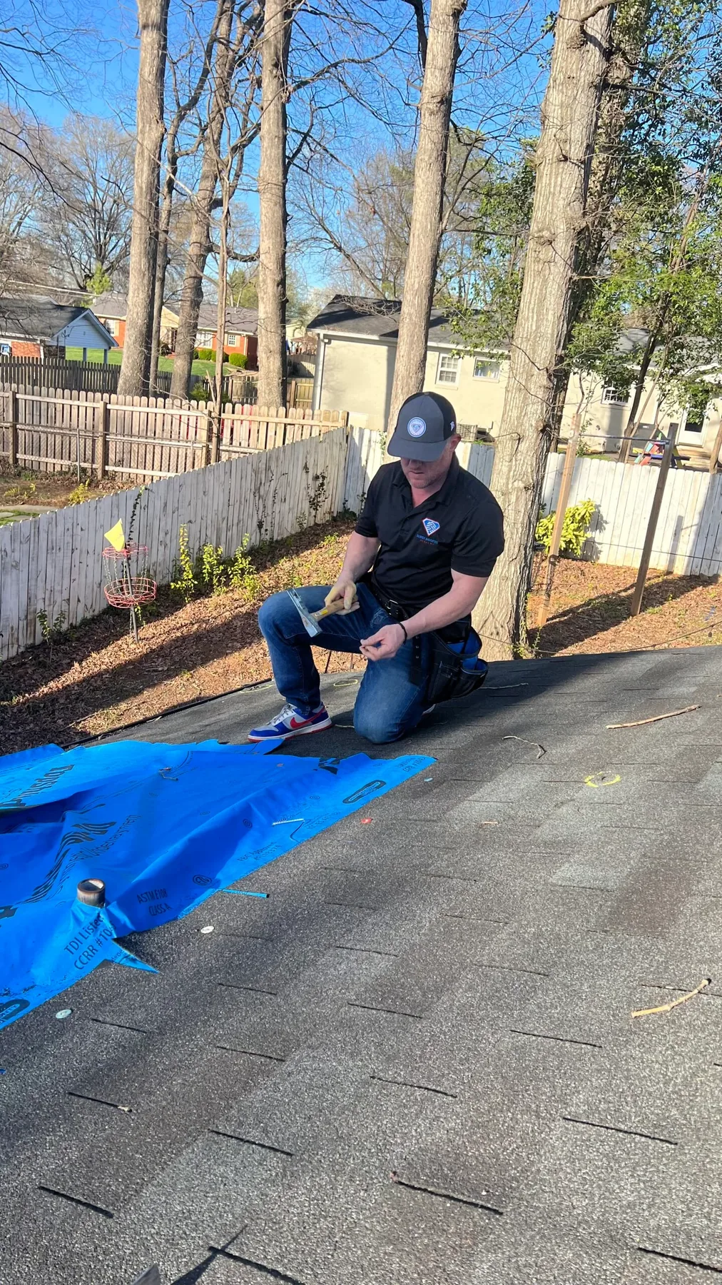 Super Roofing Company specialist inspecting a roof