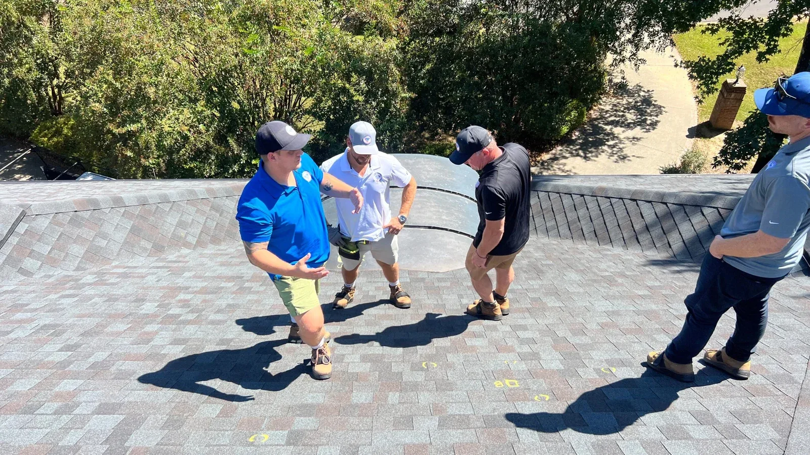 Team reviewing a finished roof