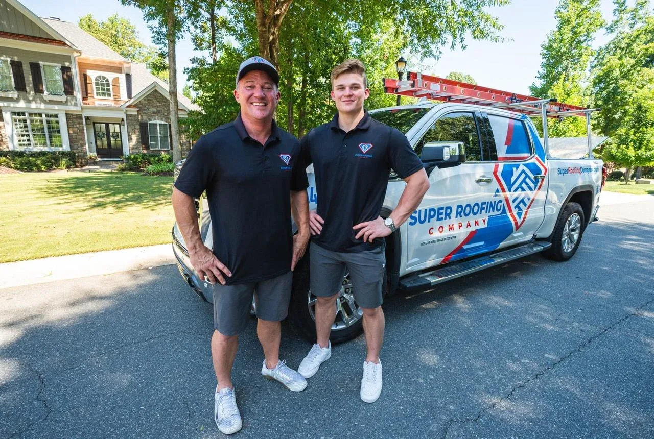 Super Roofing Company team beside branded truck
